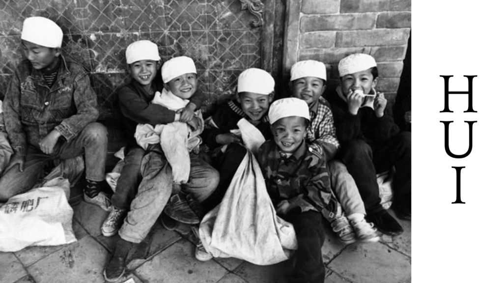 Ethnic Hui children sitting on ground