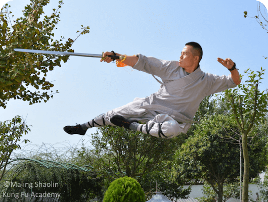 Master Bao of Maling Shaolin Kung Fu Academy doing aerial Northern Shaolin maneuver with straight sword