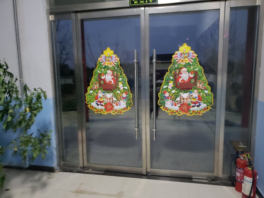 Front doors with Christmas tree decorations