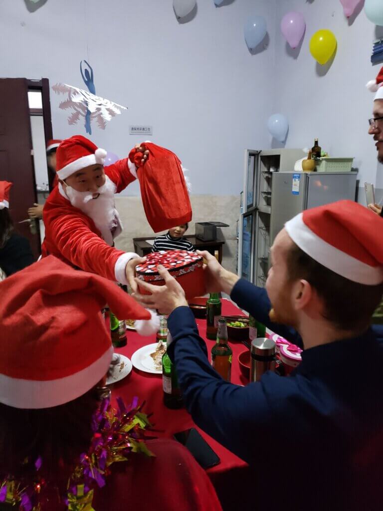 Master Ning as Santa passing out presents to students