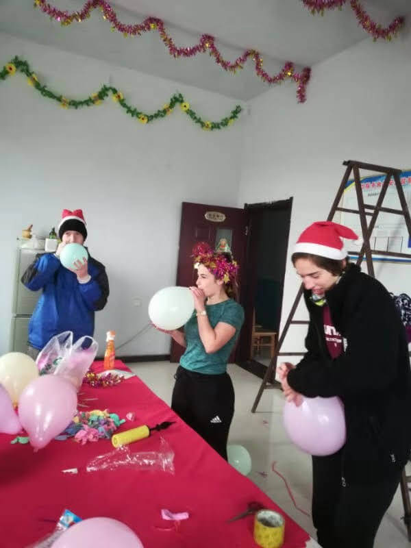 Students decorating the dining room for the Christmas feast