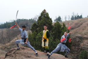 kung fu students posing with weapons in Maling shan