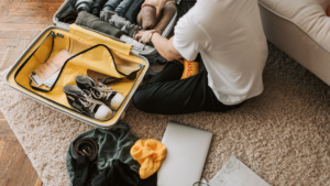 Man packing suitcase