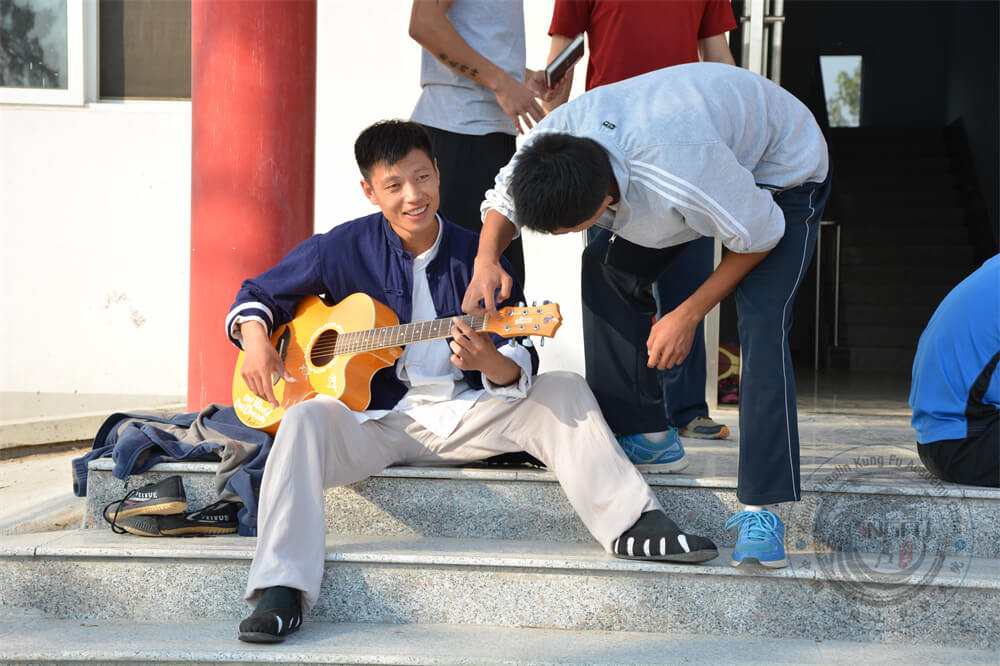 Playing guitar wih Master Tang