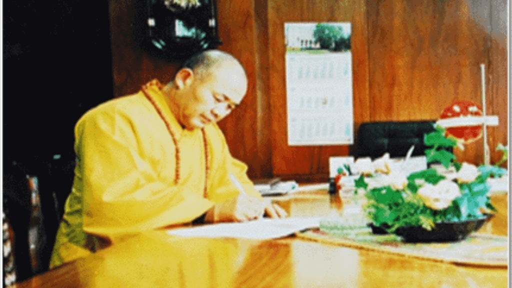 Grandmaster Shi Deqian writing one of his books.