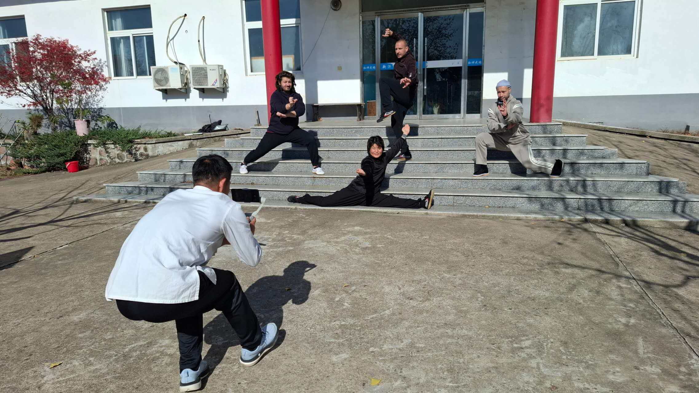 I snapped a picture of Master Bao taking photos for Fiona before leaving the school 📷
