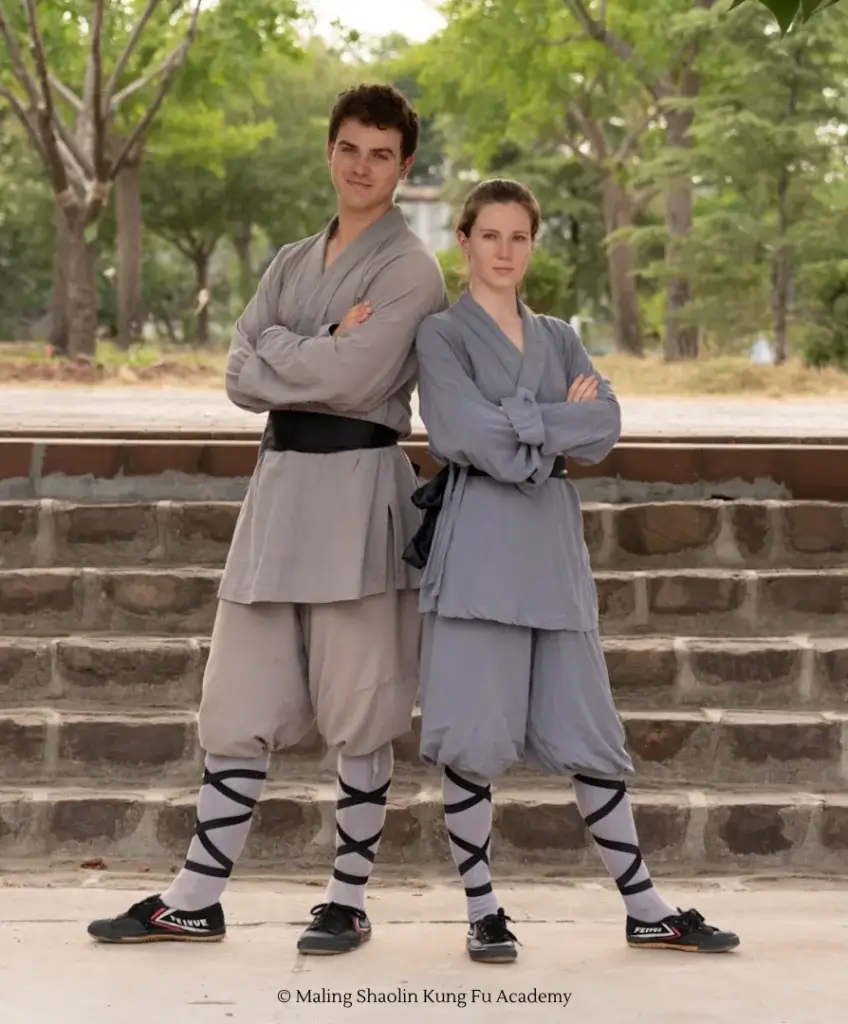 Two Maling Academy students in the school monk suits